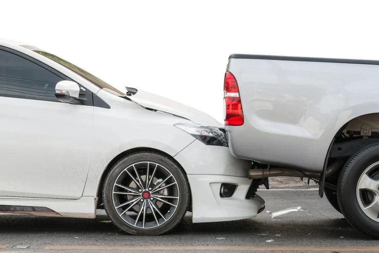 A car that ran into the back of a pick-up truck