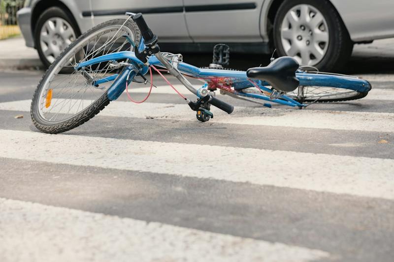 bicycle laying on a crosswalk