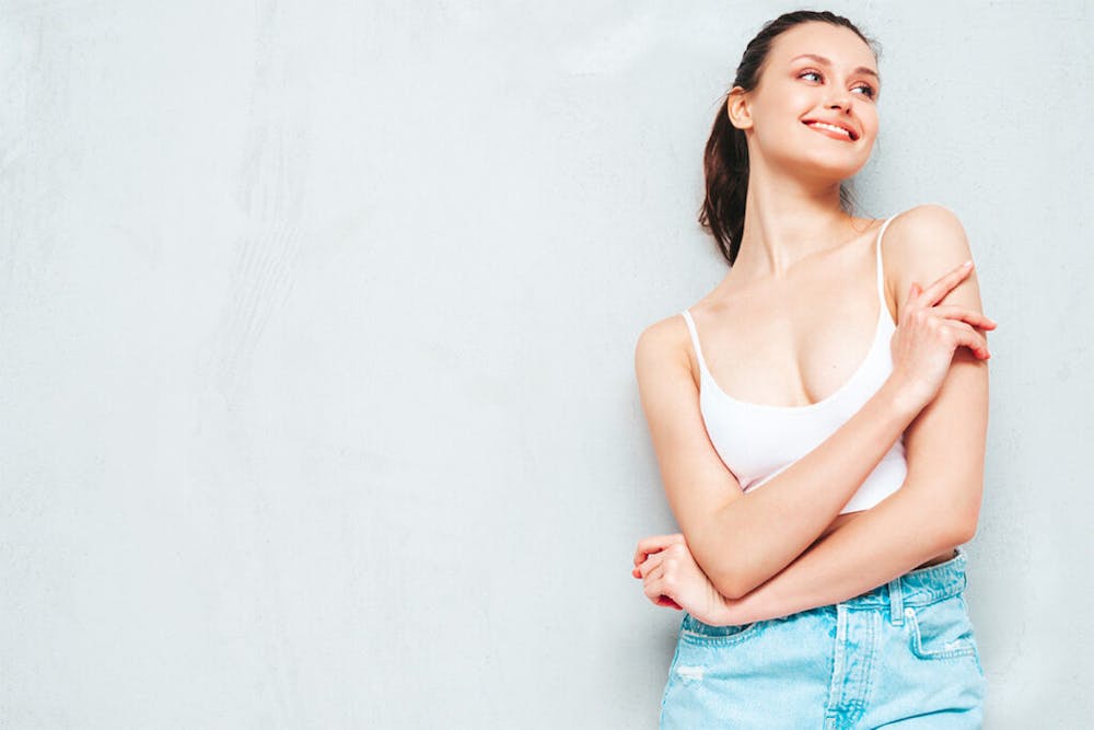 Wearing a compression garment is advised to aid in the final stages of breast reduction recovery