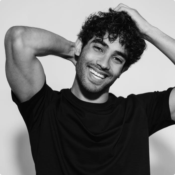 man in a black shirt smiling