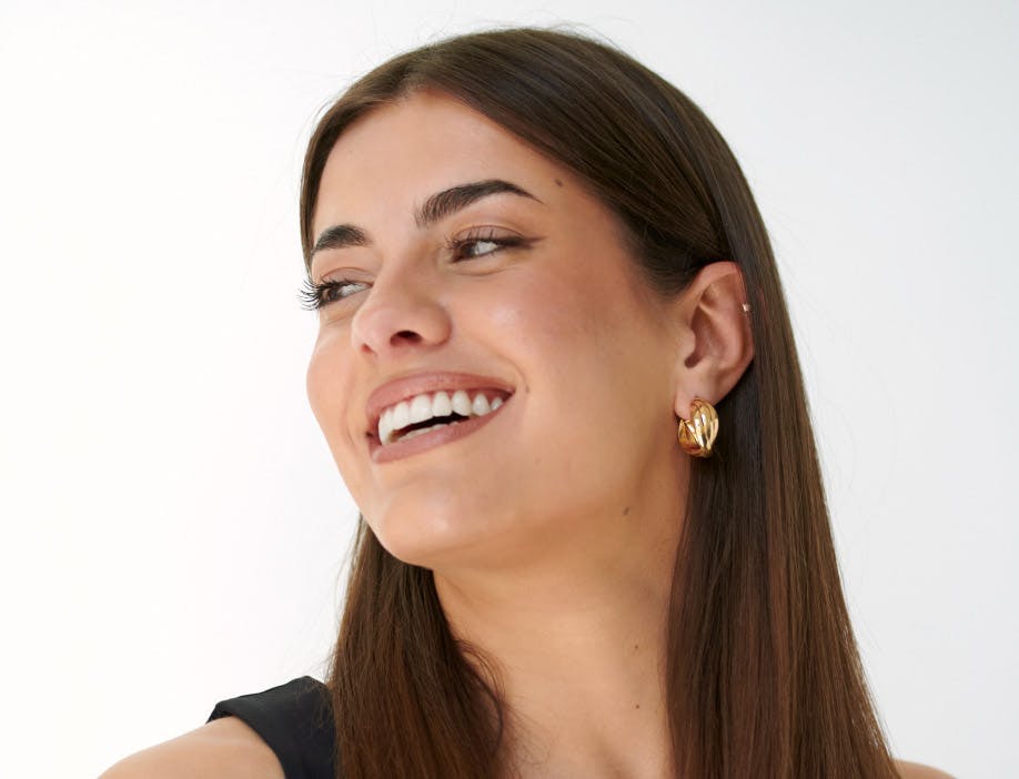 woman looking to the side and smiling