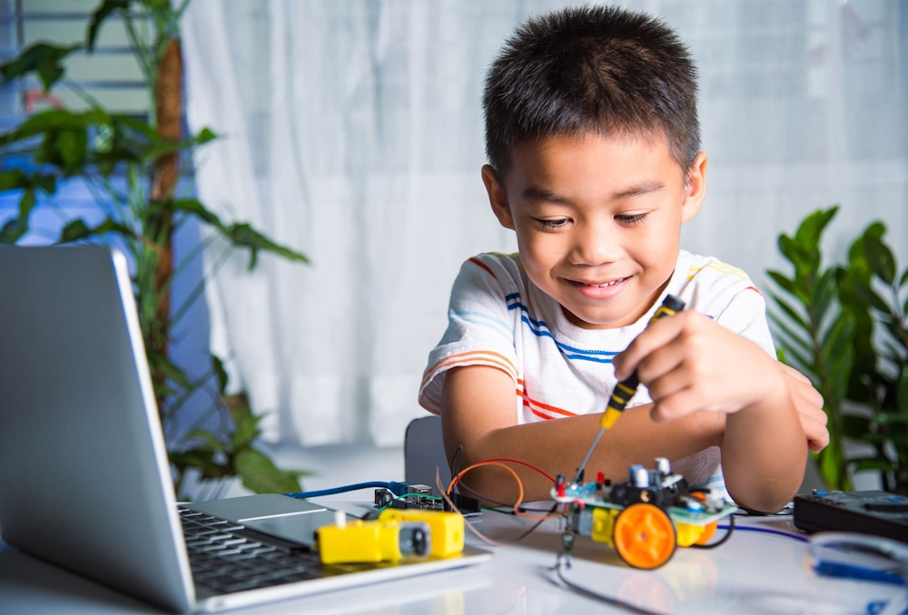 little boy playing with a toy