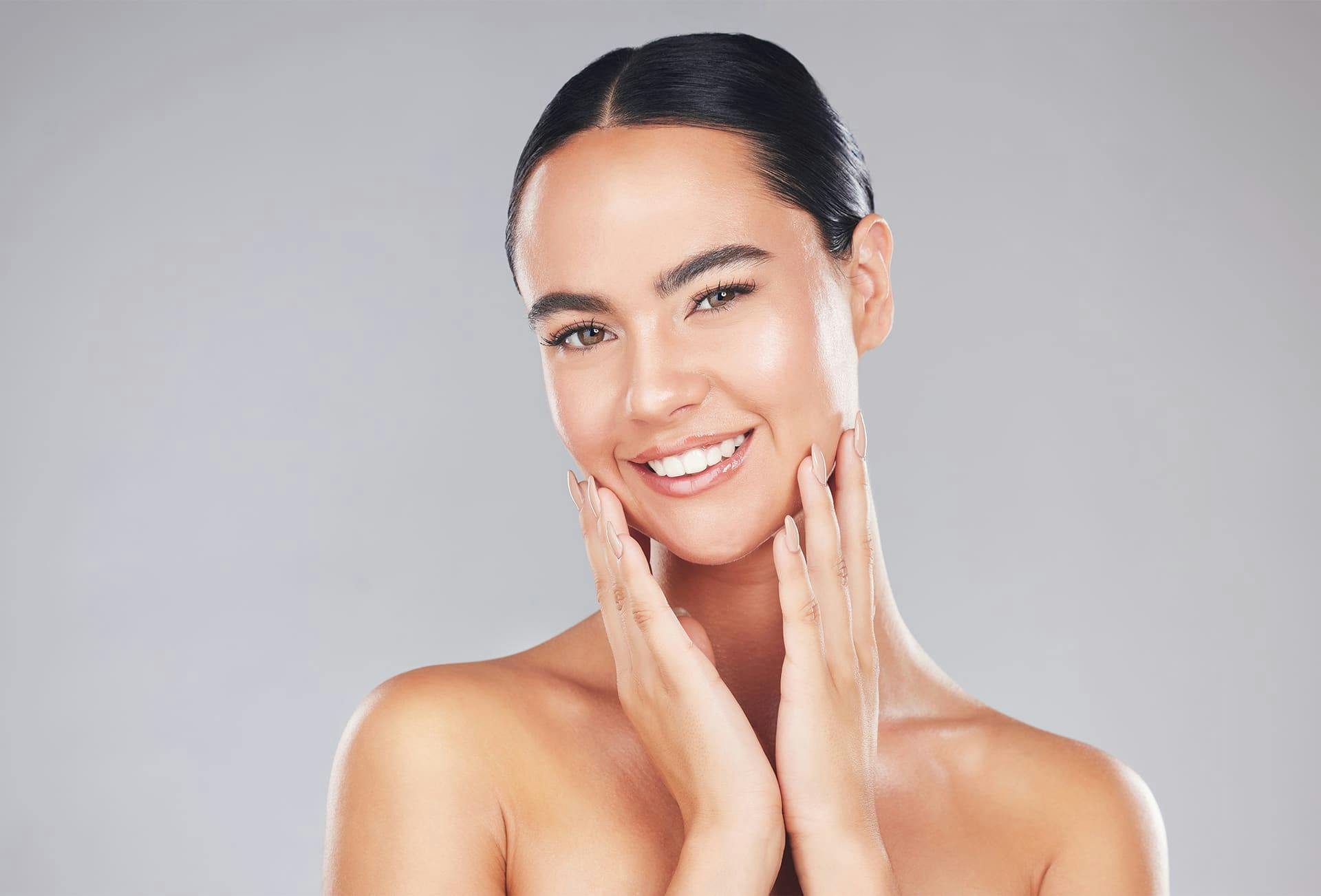 Woman with hands on her face