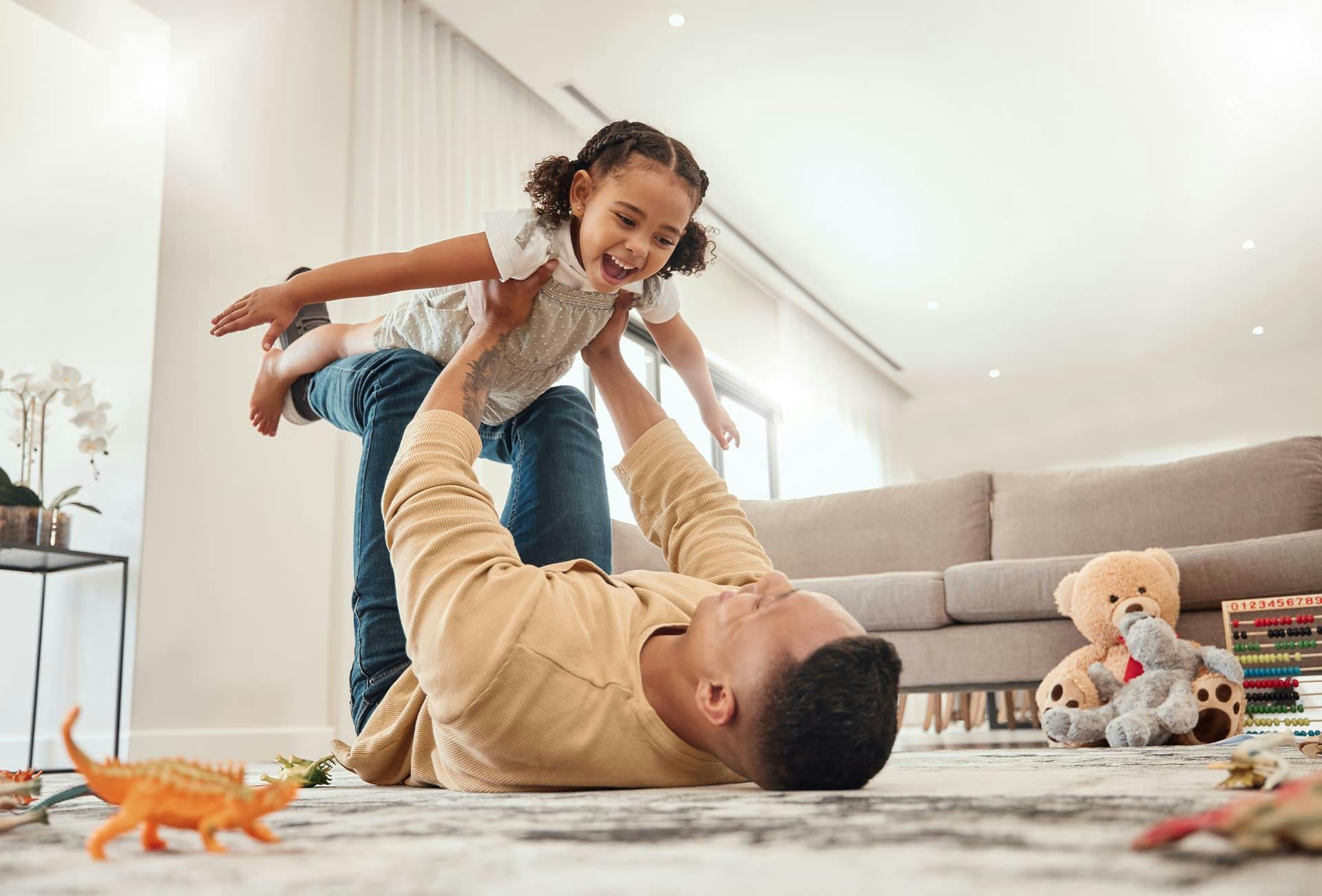 father playing with his toddler