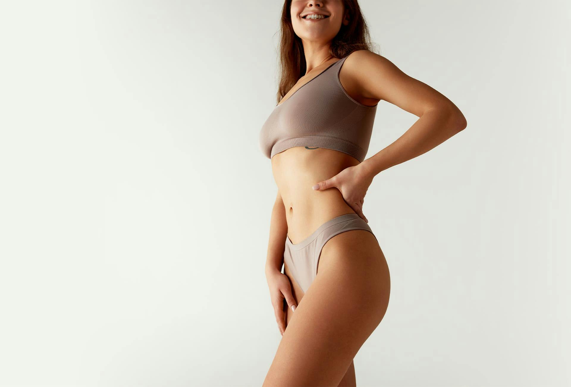 woman poses with body in bikini