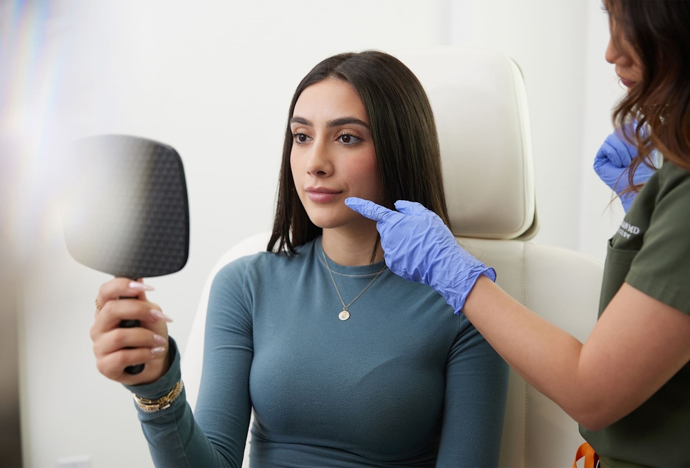 nurse pointing at patient's lips