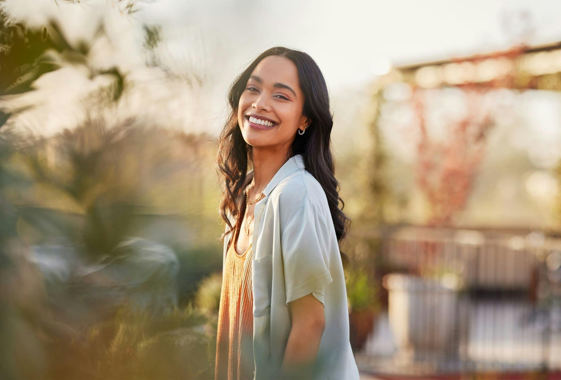 woman smiling in blue shirt