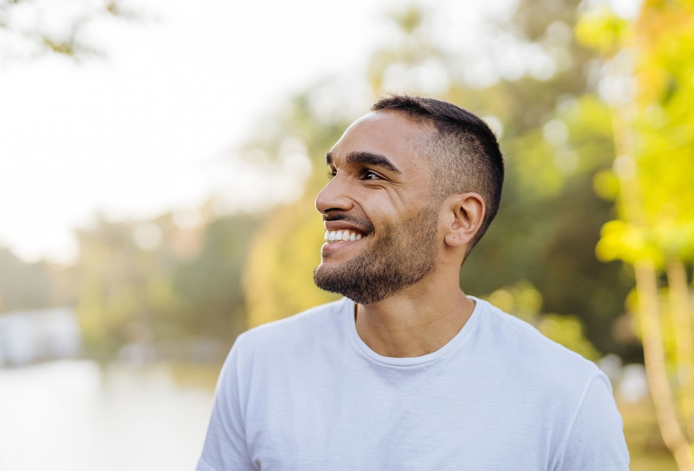 man smiling and looking to the left