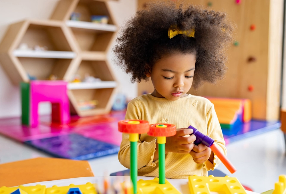 toddler playing with kid toys