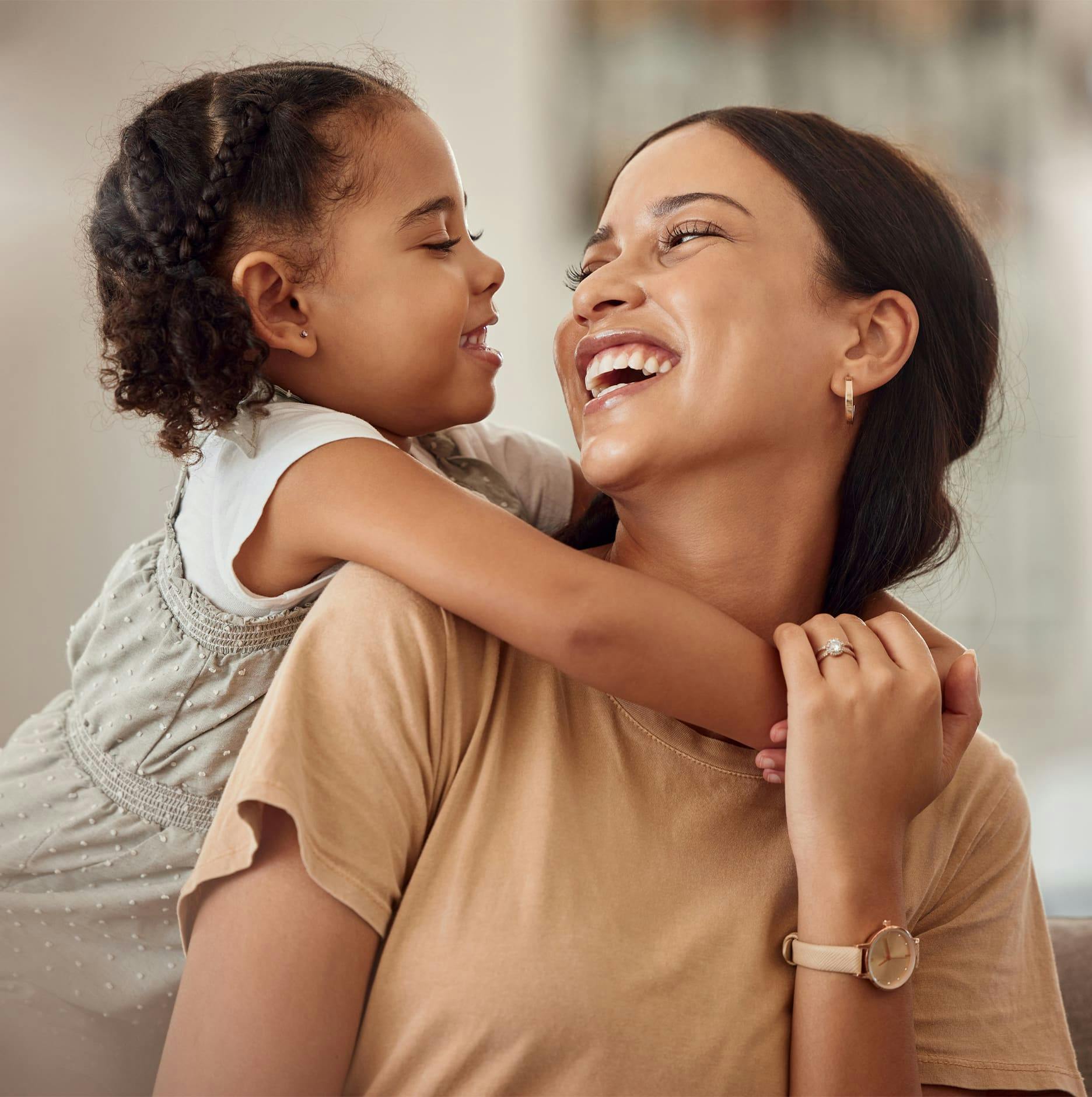 daughter hugging her mom around the neck