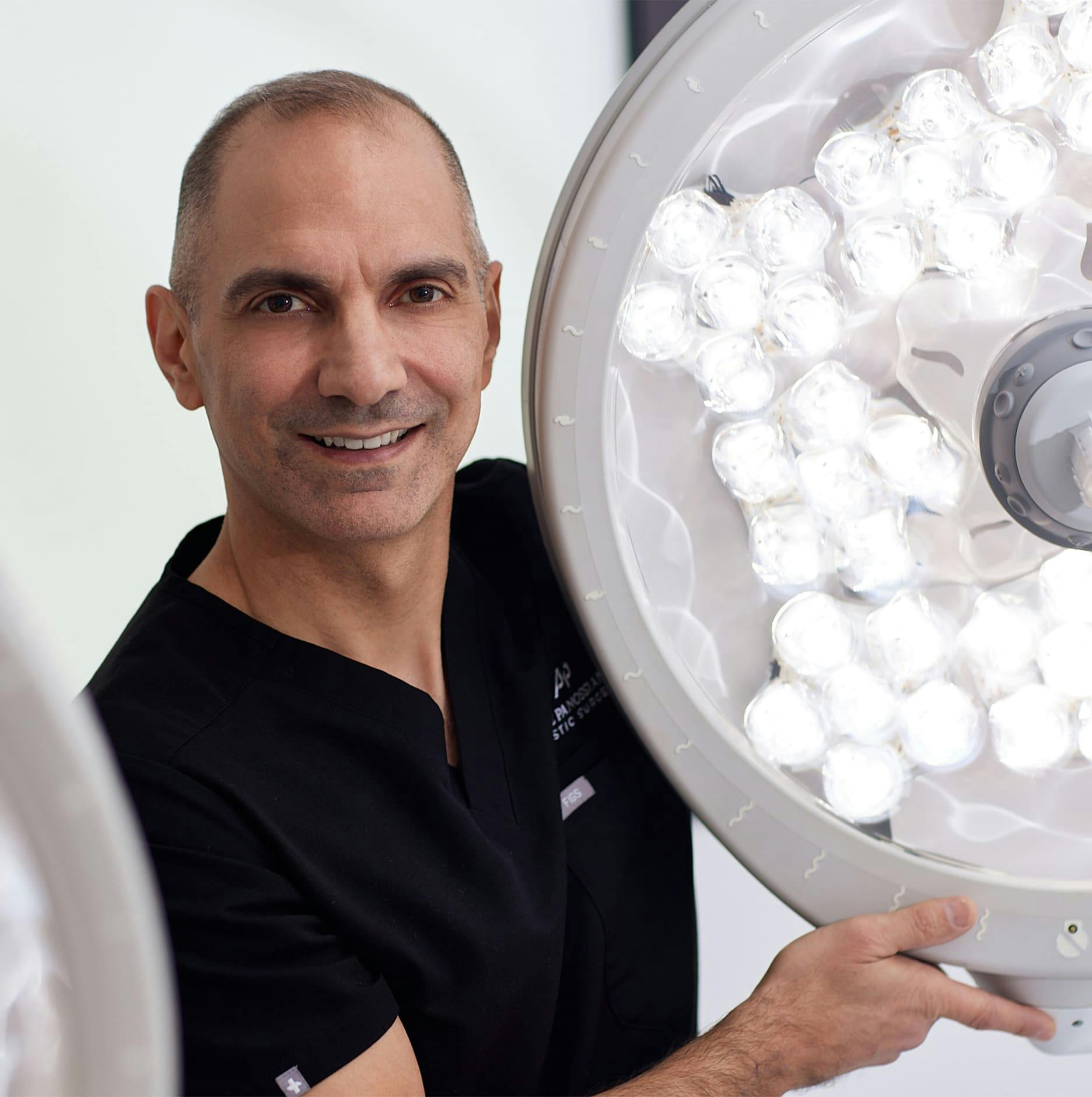 Dr. Panossian next to light