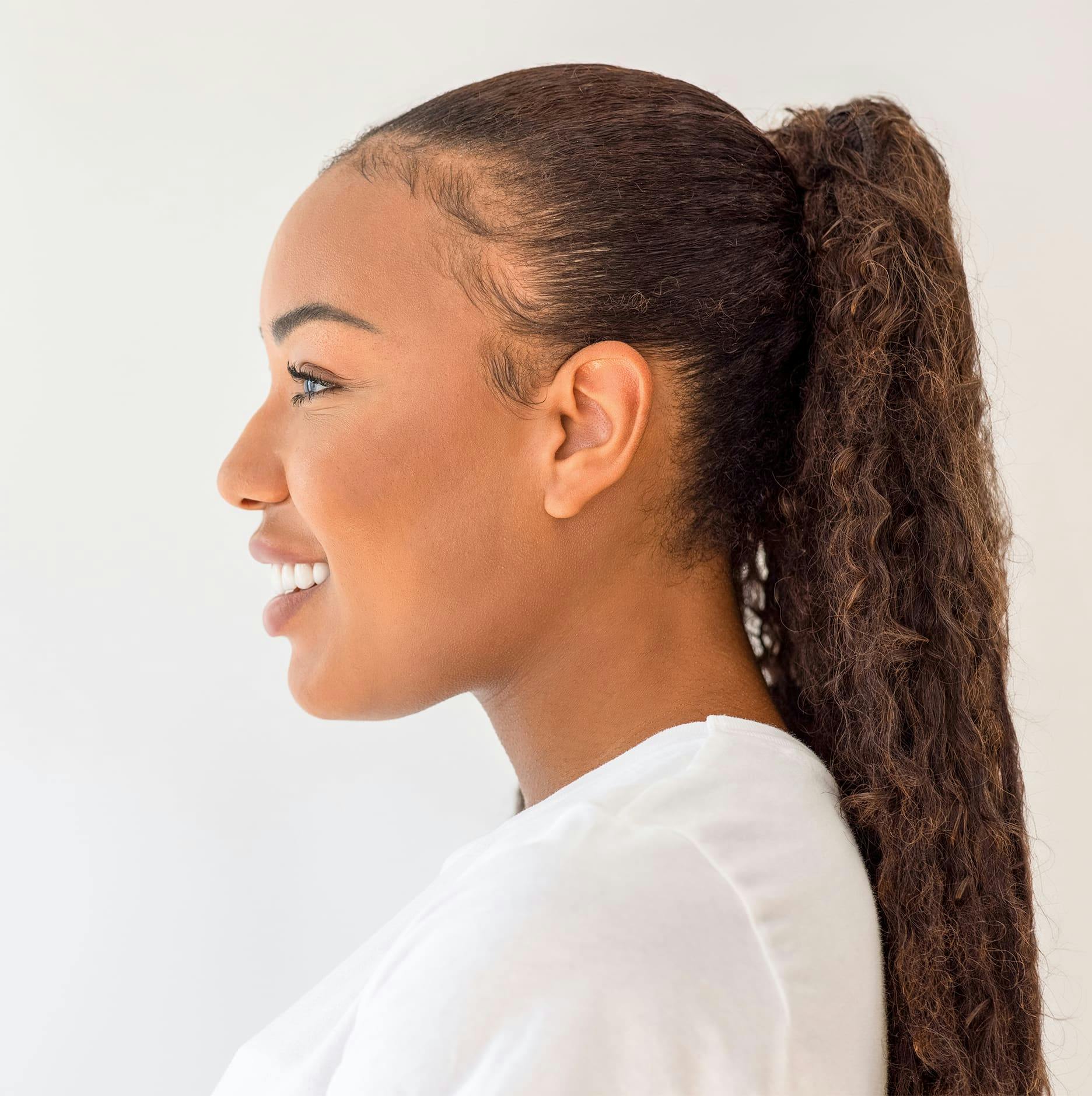 woman side angle with brown coily hair