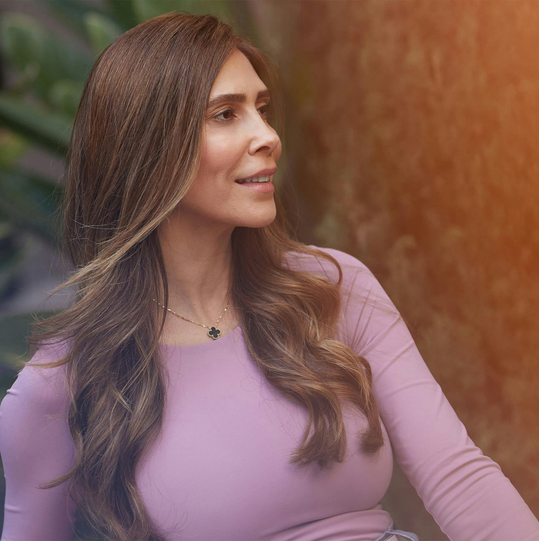 patient in pink long sleeve looking to the right