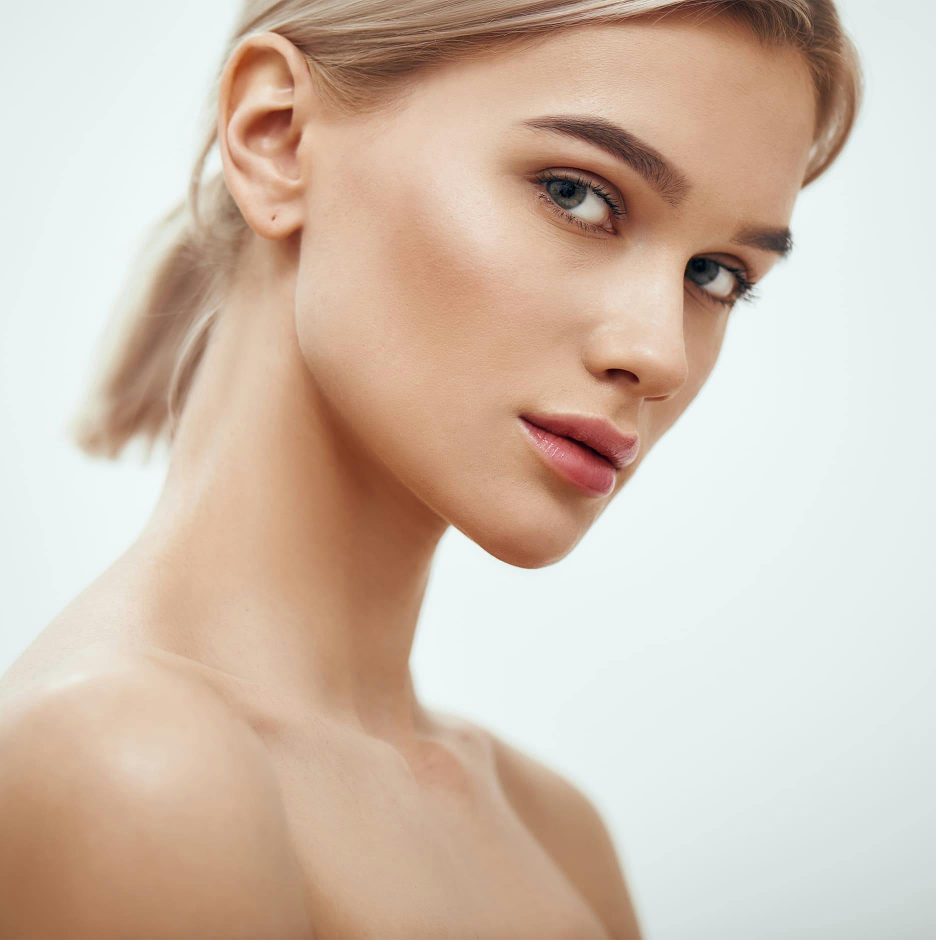 woman with short blonde ponytail