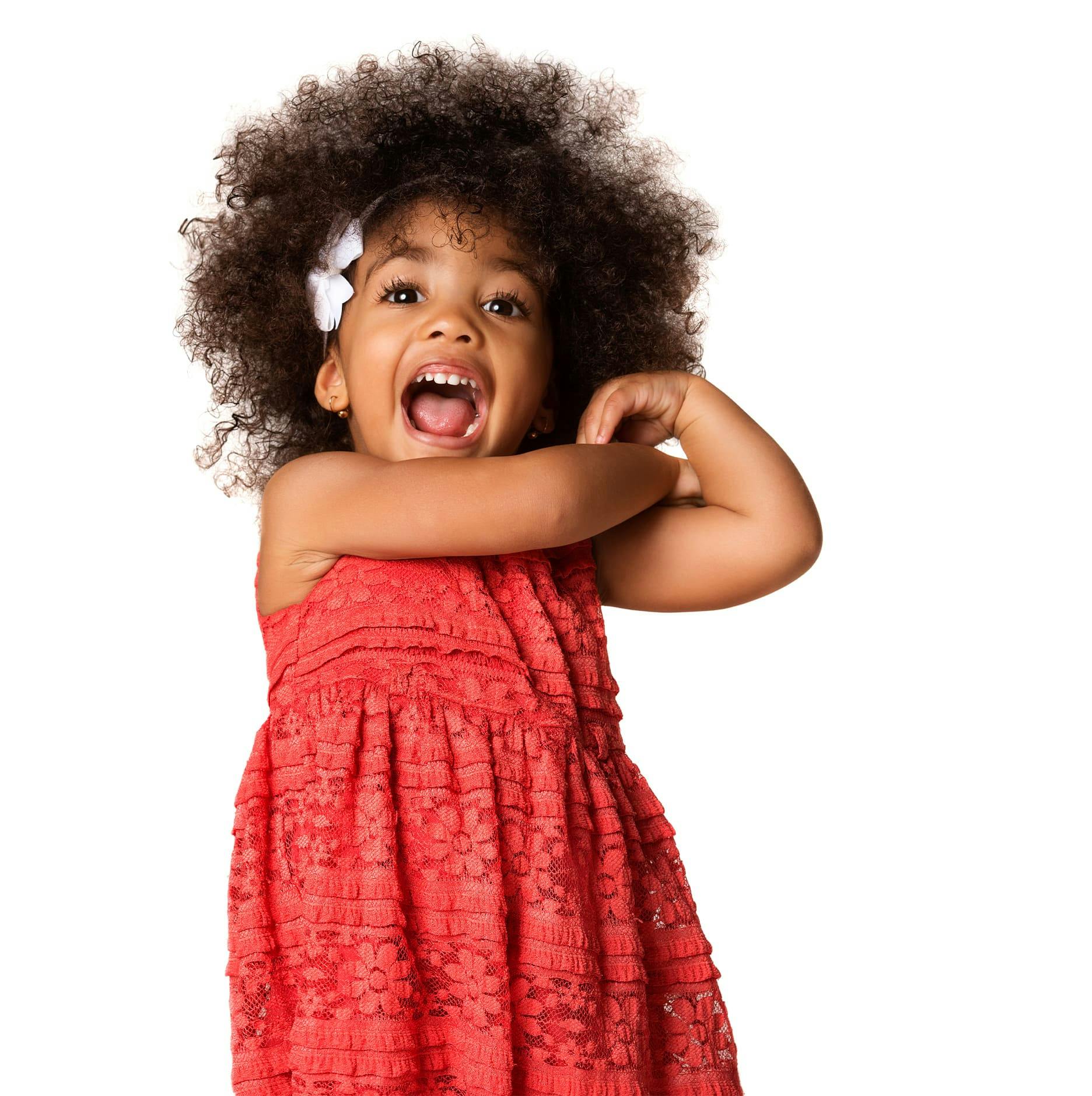 toddler with afro in red dress