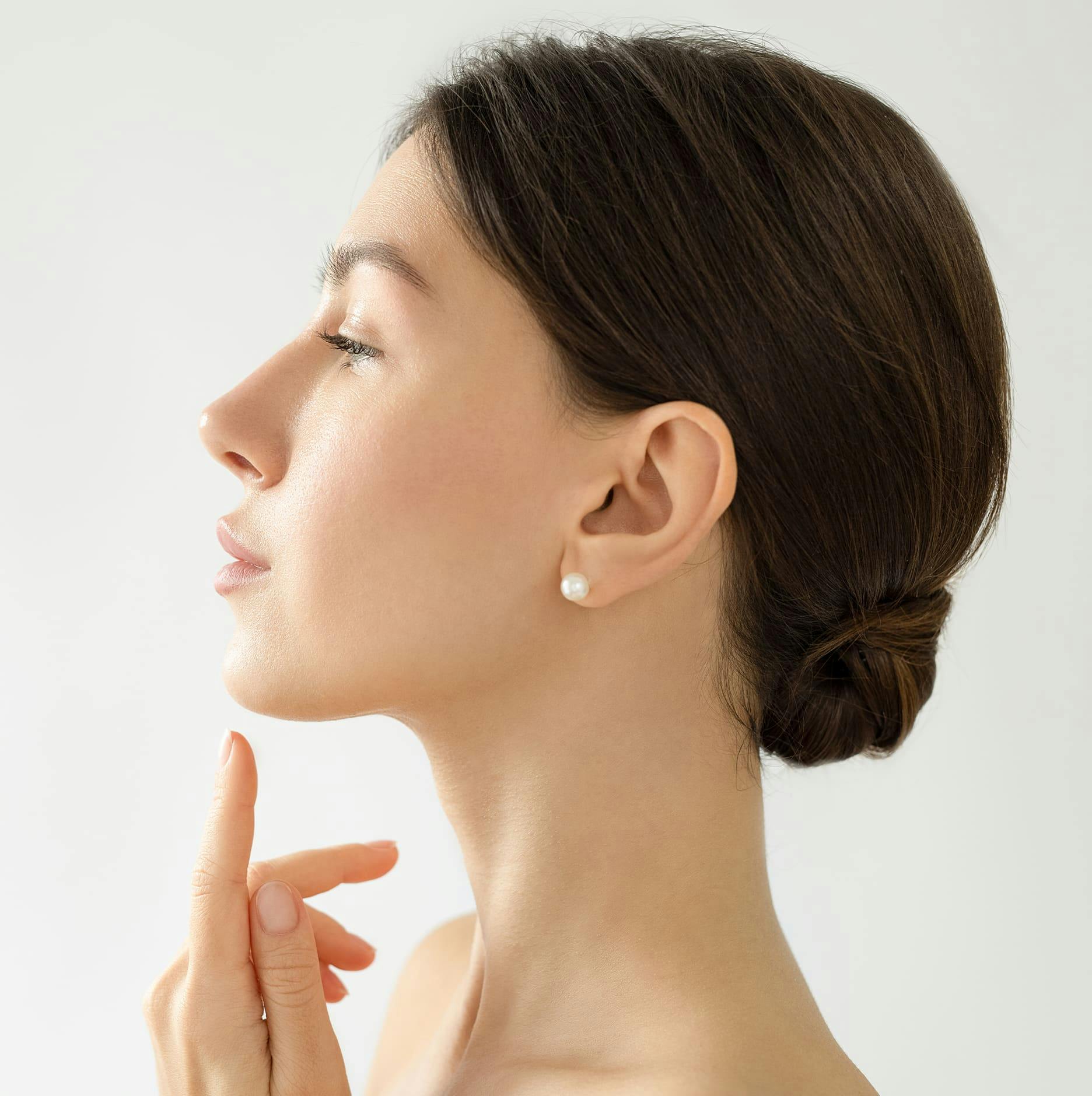 side angle of woman in bun
