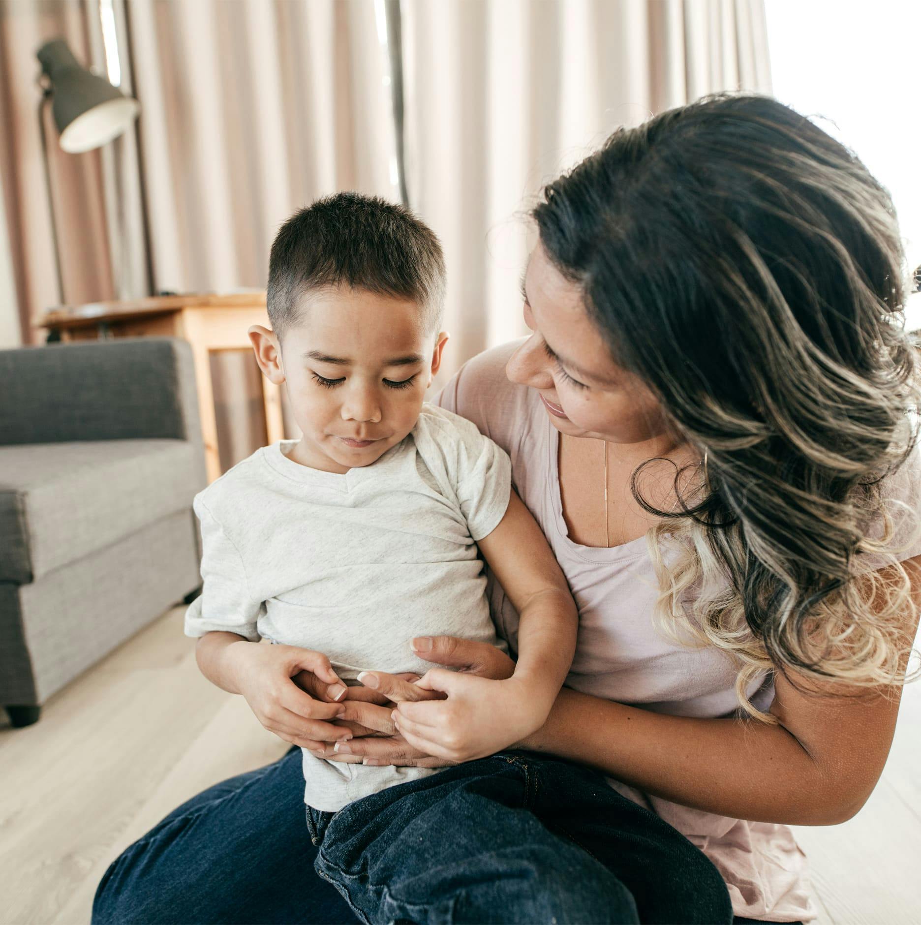 toddler in mother's lap