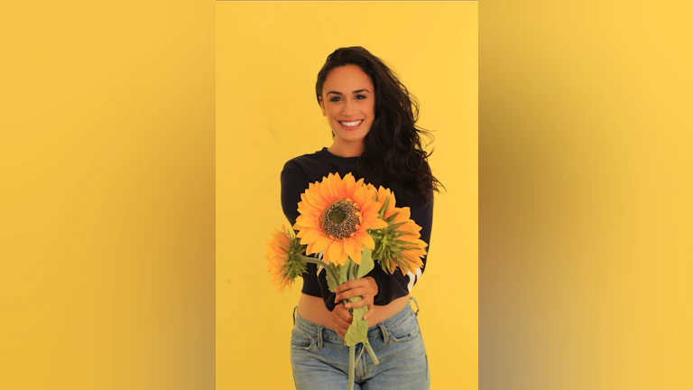 Woman in front of yellow background