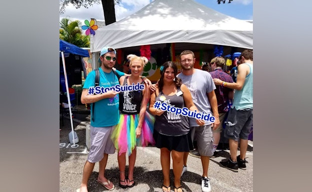 Group holding #StopSuicide signs