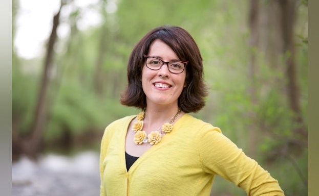 Woman standing in forest