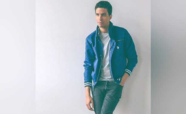 Man leaning against wall