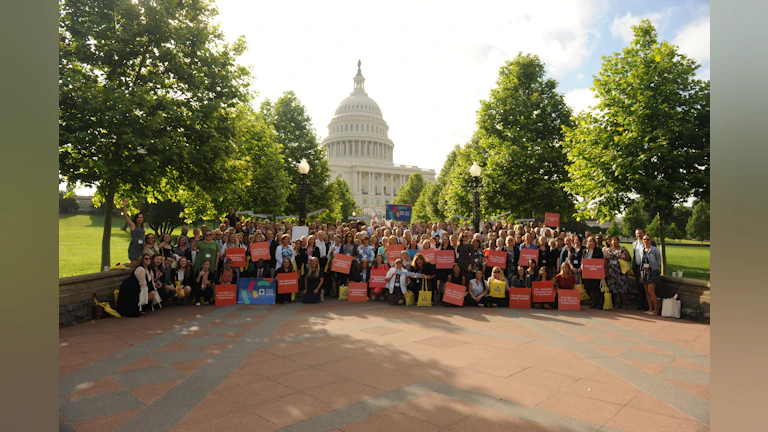 Group standing in front of capitol building