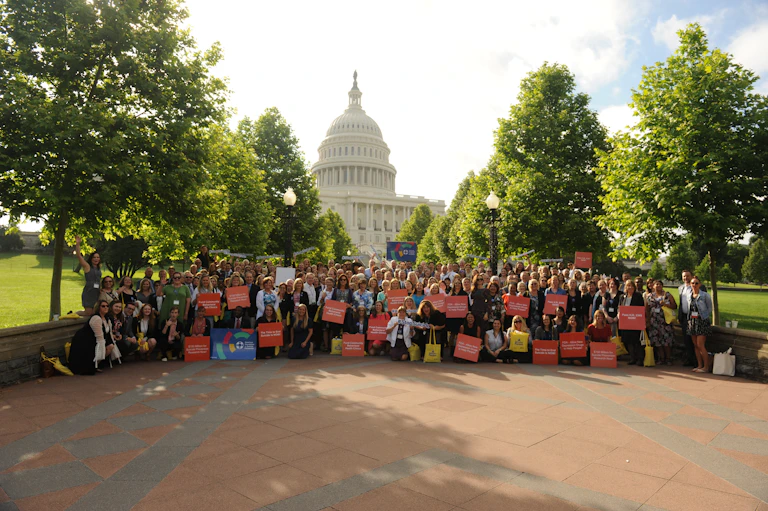 Group standing in front of capitol building