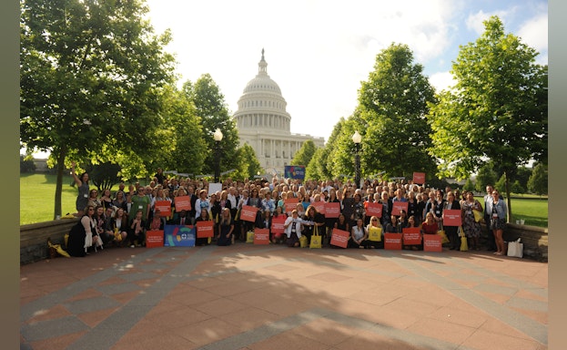 Group standing in front of capitol building