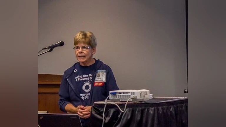 Woman speaking at event