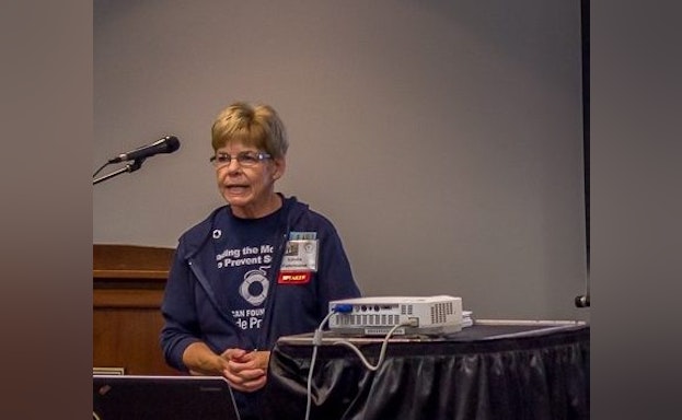 Woman speaking at event