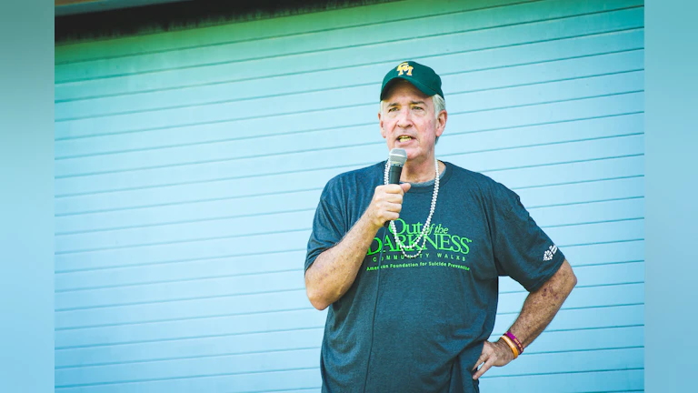 Man speaking into microphone