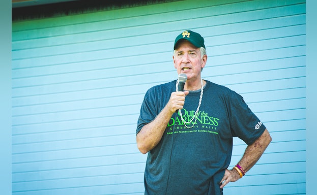 Man speaking into microphone