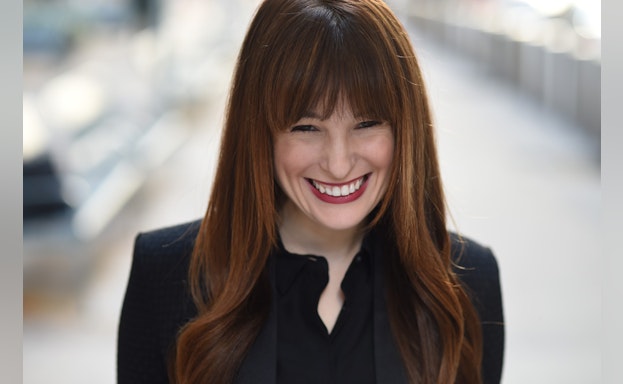 Woman standing for headshot