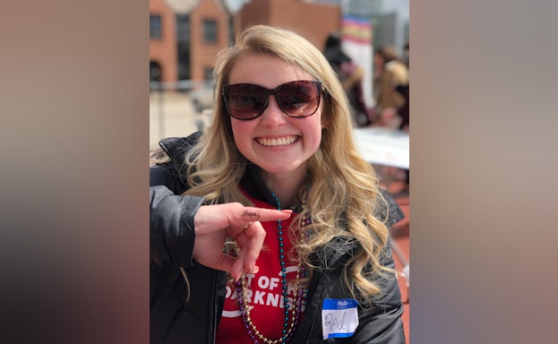 Reid smiling at the camera