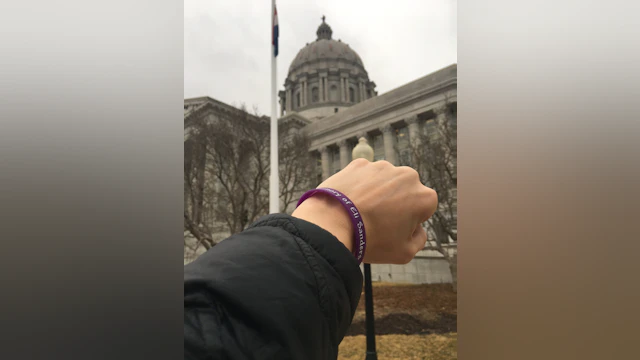 Person's wrist with wristband