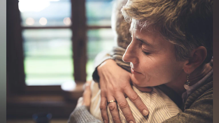 Two people hugging