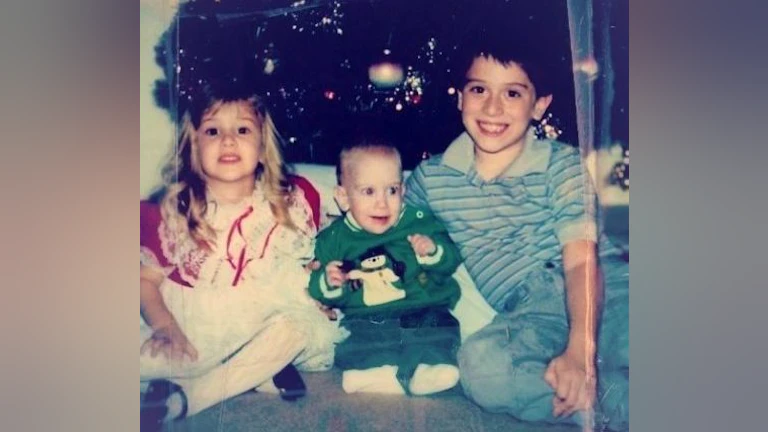 Children in front of christmas tree