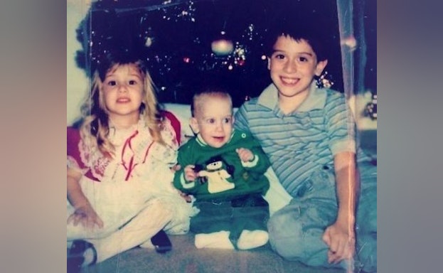 Children in front of christmas tree