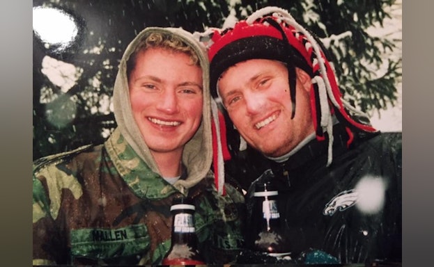 Two people in front of tree