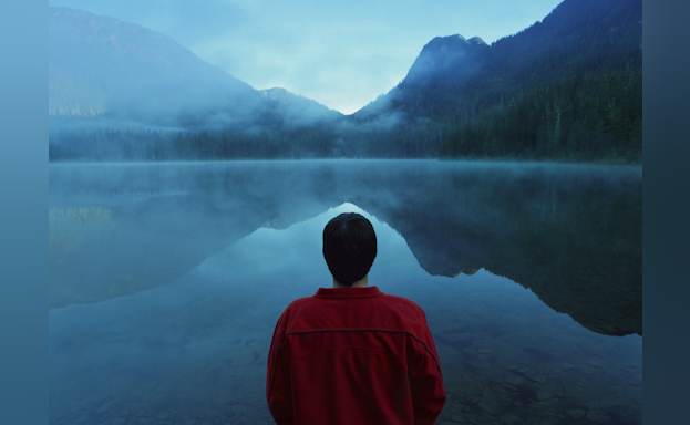 Man looking out at lake