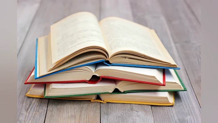 Books on wooden floor