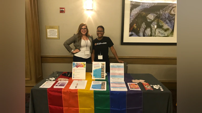 Volunteers at table with AFSP materials