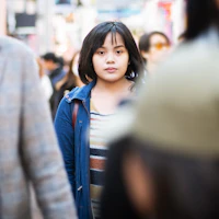 Woman walking in crowd