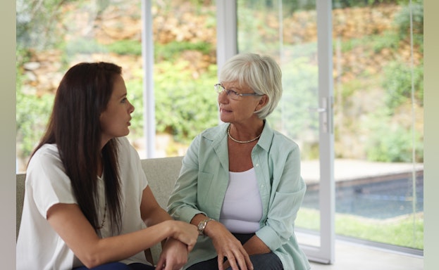 two women talking indoors