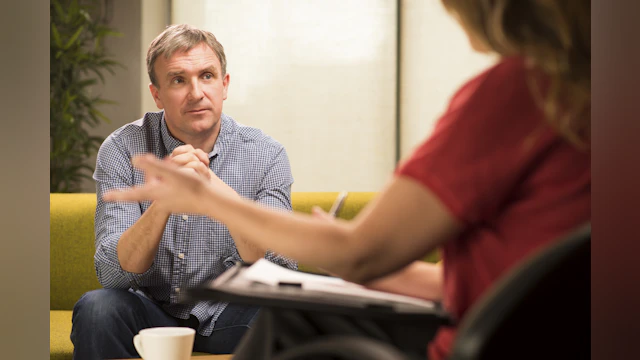 Man listening to therapist