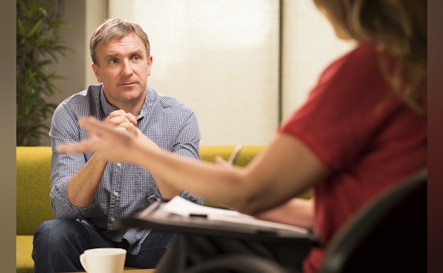 Man listening to therapist