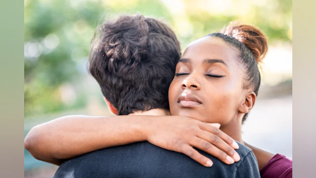 Woman and man hugging