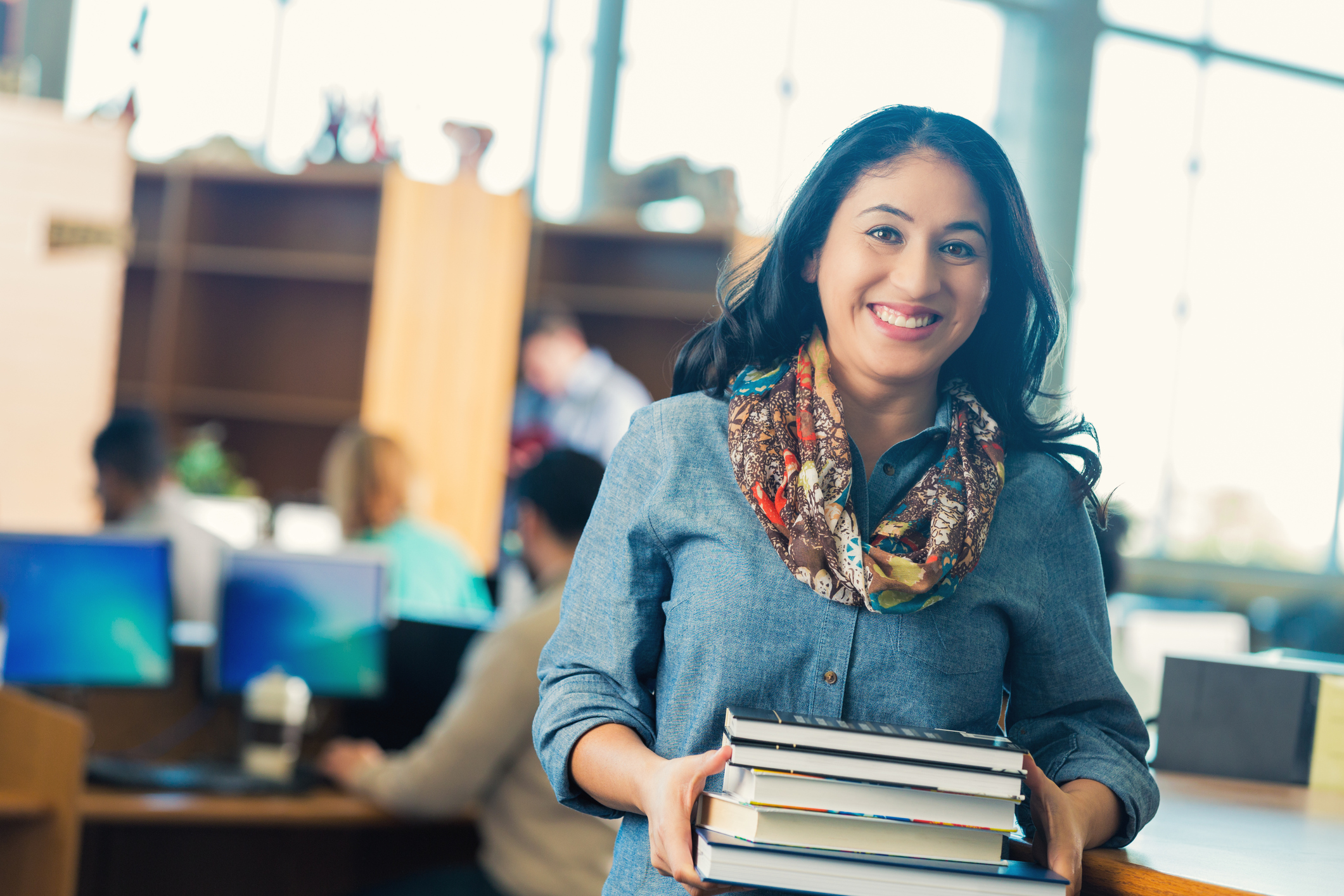 Woman holding books
