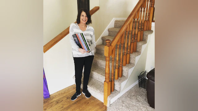 Woman standing in front of stairs