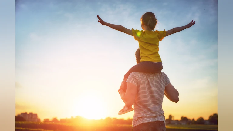 Man with child on shoulders